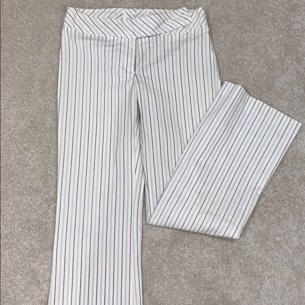 White pants with gray and tan stripes.